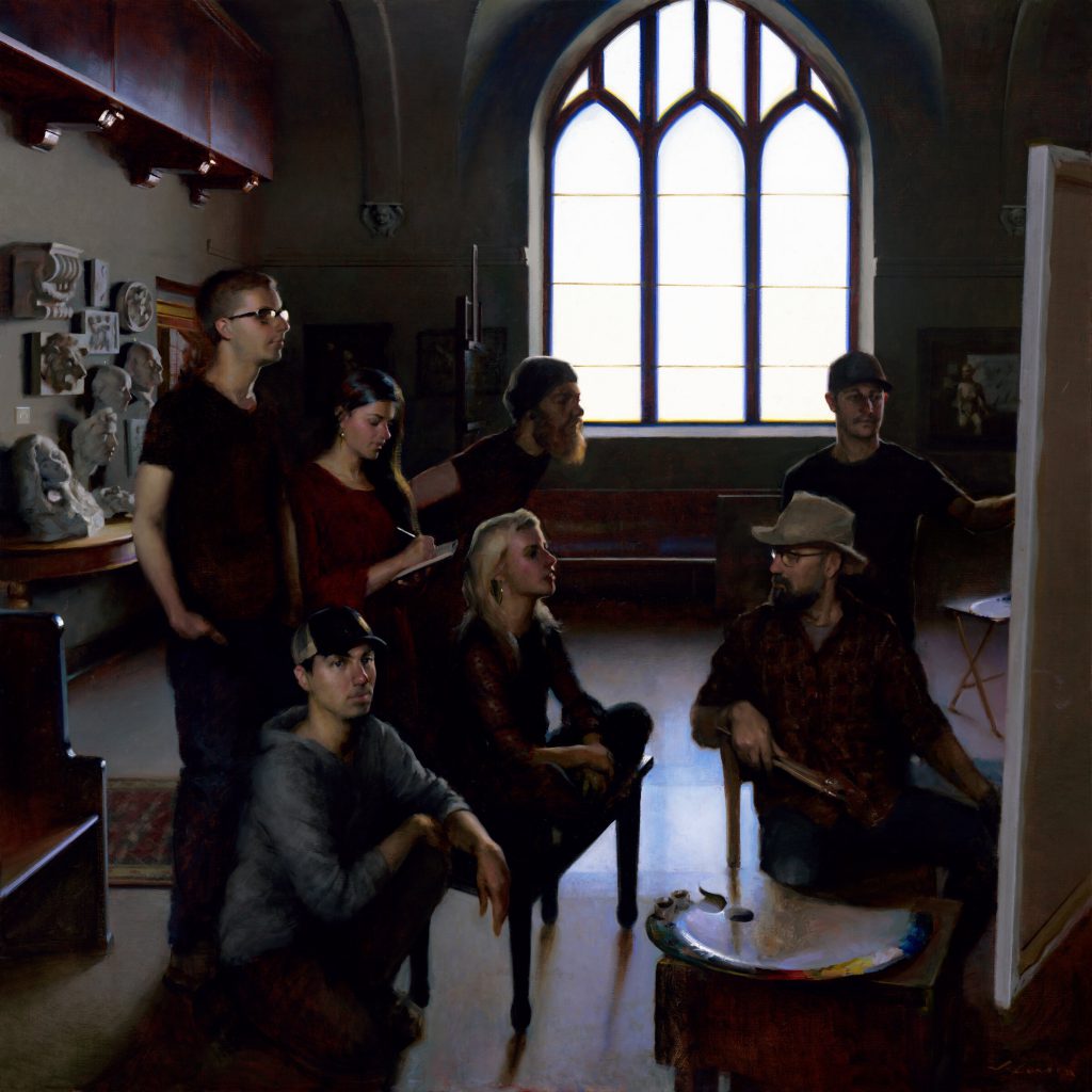 A group of seven people, including three standing and four seated, are gathered in an art studio. They focus intently on a large canvas. The room has a large, arched window in the background, with sculptures and various art supplies around.