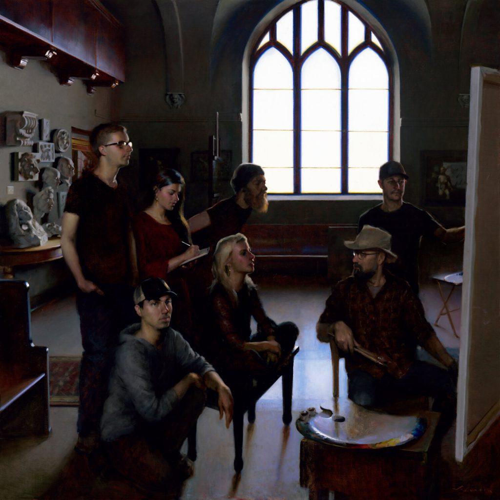 A group of seven people, casually dressed, gather in an art studio at a Duluth Minnesota art school. With a large arched window casting soft light, some are seated while others stand intently focused on a canvas. Art supplies and sculptures adorn the dimly lit background.