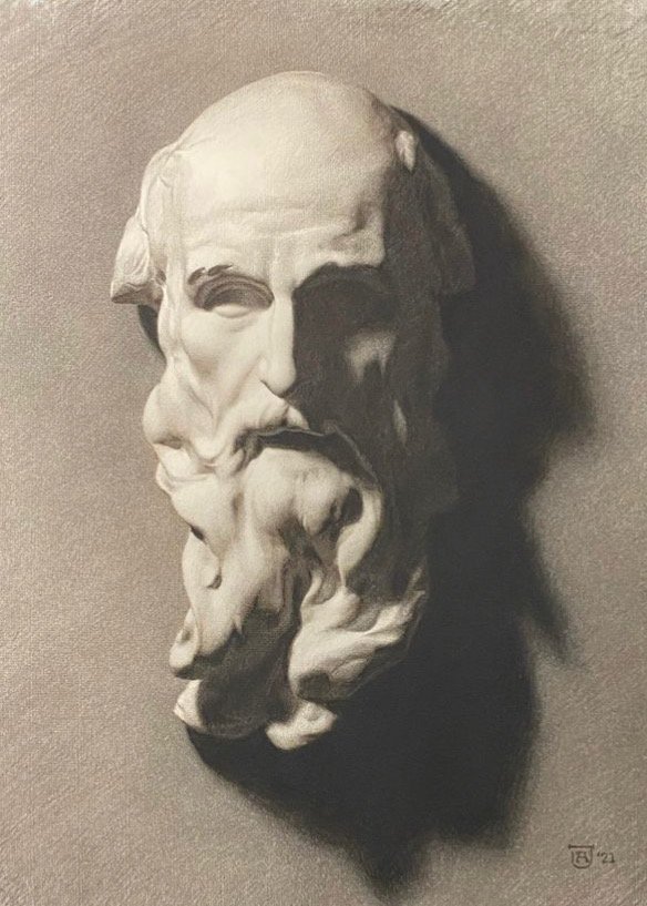 A grayscale drawing features a classical-style sculpture of a bearded man's head. Shadows fall to the right, emphasizing the sculpture's details and contours against a textured background.